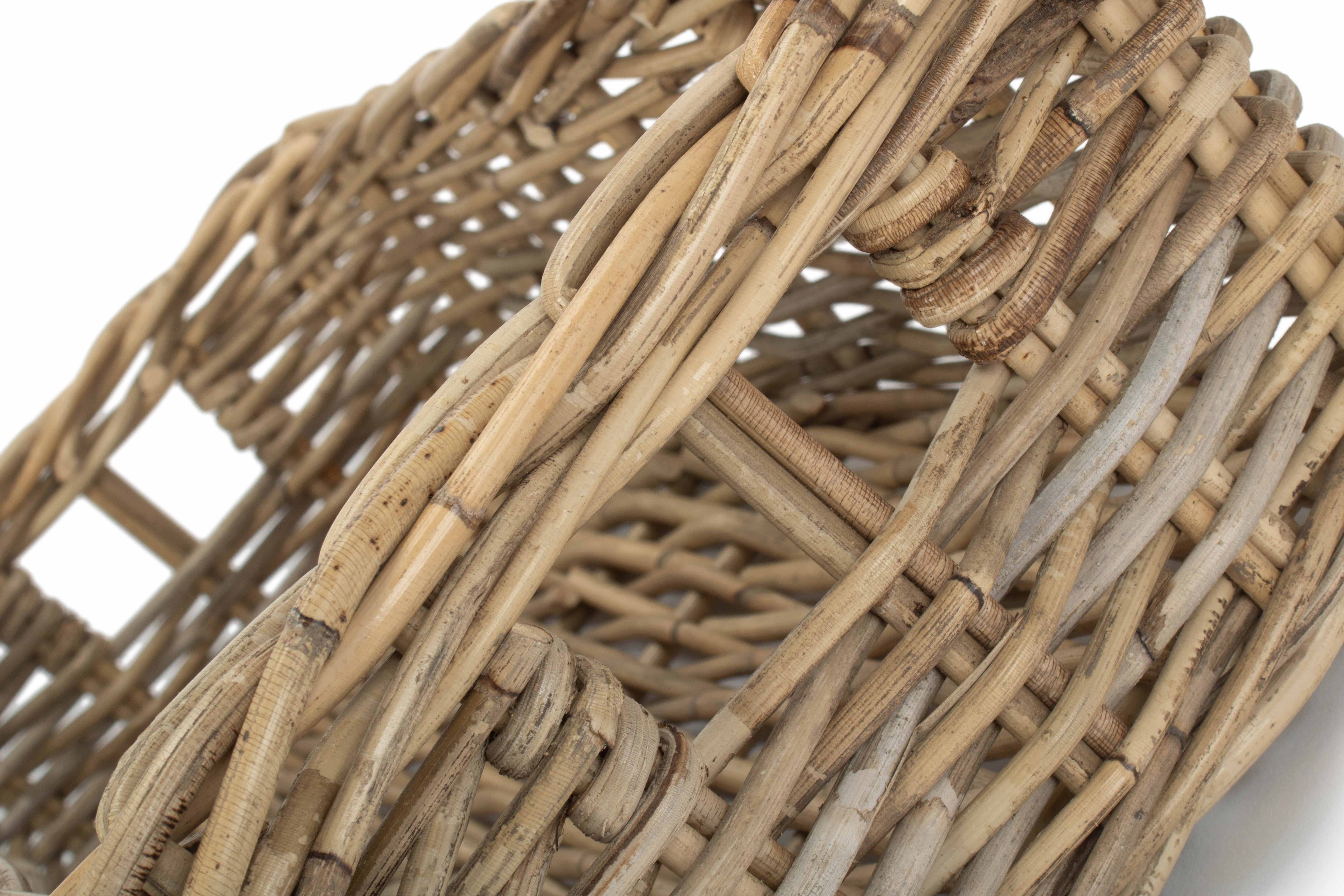 Close up of a long narrow shelf storage basket. Made from natural wicker.