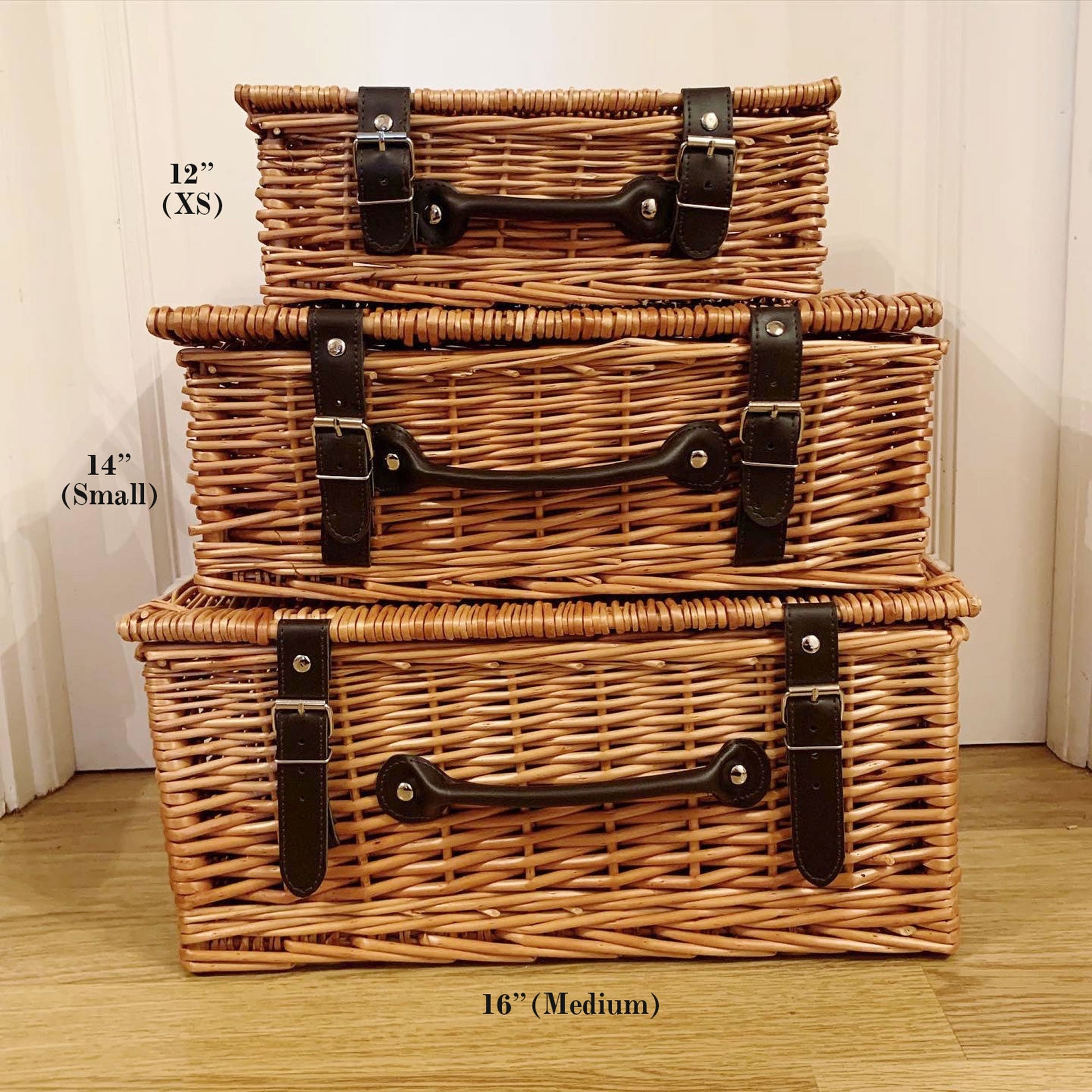 Wicker hamper baskets with leather straps